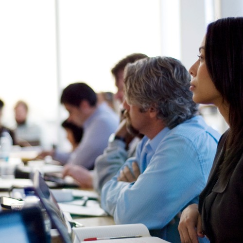conference attendees taking notes