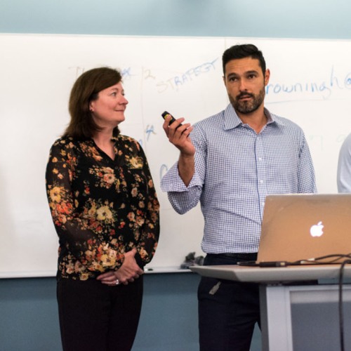making a presentation in front of a whiteboard